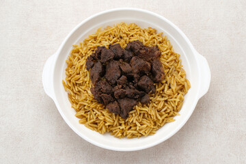 Nasi Kebuli Kambing, Arabian Rice with herb, spices and goat meat topping
