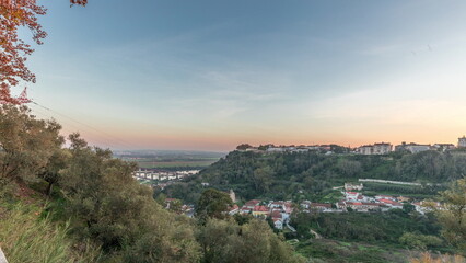 Panorama showing sunset over the Castle of Almourol on hill in Santarem aerial timelapse. Portugal
