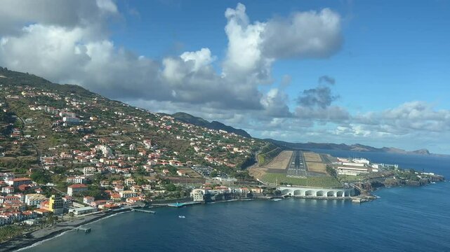 Pilot FPV POV in a real time approach to Madeira Funchal airport in a windy day with a blue sky and some clouds. Immersive pilot&rsquo;s perspective. 4K 60FPS