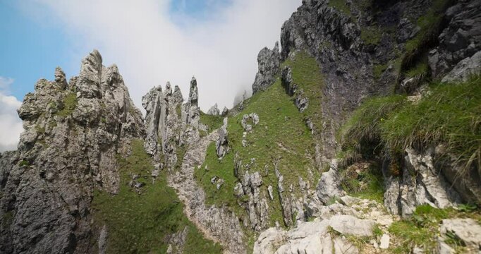 Lombardy, Italy - A Picturesque View of Rugged, Jagged Peaks Set Against a Cloudy Sky in Grignetta - Low Angle Shot