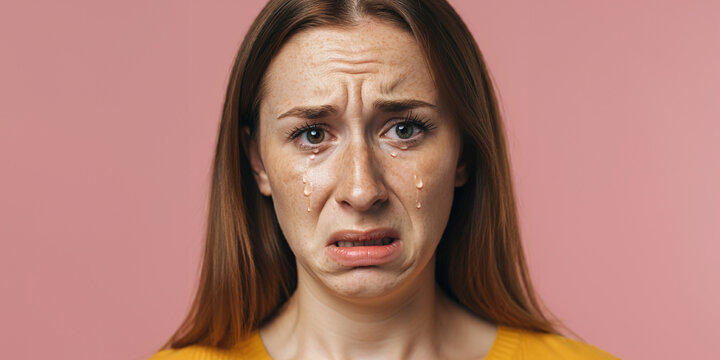Woman with a tearful and resentful expression