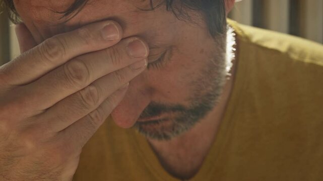 Morning hangover symptoms, closeup of male face in 4K