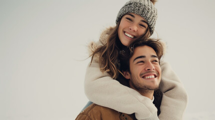 Fototapeta premium Young happy couple in glasses celebrating on top of each other