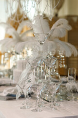white table decorated with down, pearls, ribbons, prepared for a wedding ceremony, New Year's table