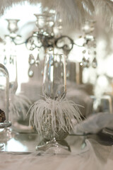 white table decorated with down, pearls, ribbons, prepared for a wedding ceremony, New Year's table