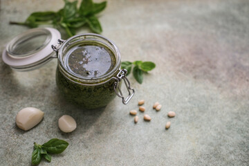 Jar with fresh homemade pesto sauce