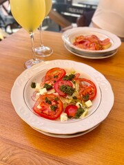 autumn lunch on the open veranda lentils with lemon, lemonade, feta, tomato and pesto salad