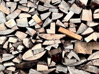 chopped stock of firewood for the winter stacked on top of each other, authentic texture