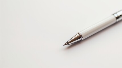 Close-up of a Sleek White Ballpoint Pen on a Clean White Background