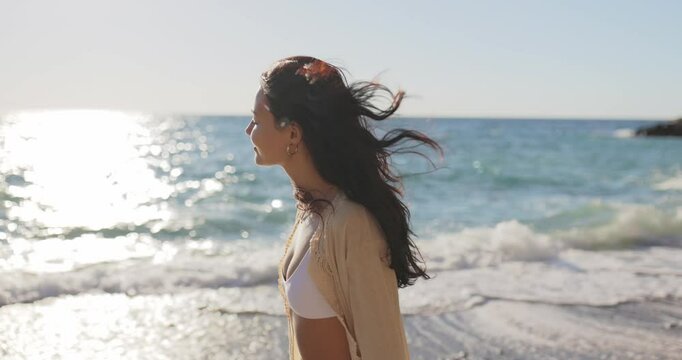 Slow Motion of Woman Walking Along Sunlit Beach in Antalya, Turkey