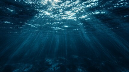 Fototapeta premium Sunbeams Penetrating the Dark Depths of the Ocean