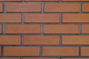 Macro of red smooth brick wall with standard stretcher bond