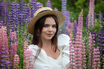 Portrait of a girl wearing a straw hat in lupine colors