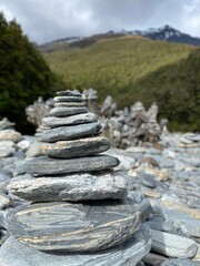 Stacks of rocks at Fantail Falls ,Haast Pass, South Island , New Zealand 