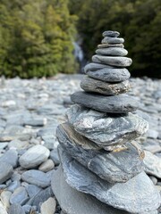 Stacks of rocks at Fantail Falls ,Haast Pass, South Island , New Zealand 