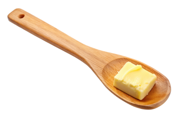 Wooden spoon with butter isolated with transparent background.