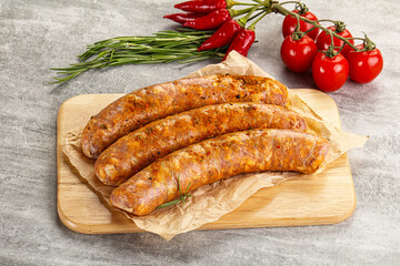 Raw sausages with spices and herbs