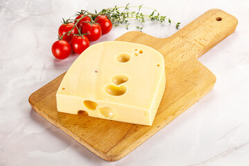Maasdam cheese brick over board