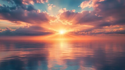 Obraz premium Dramatic Sunset Over a Tranquil Sea with a Reflection of the Sky in the Water