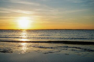Obraz premium Sunset over a beach in the South of England