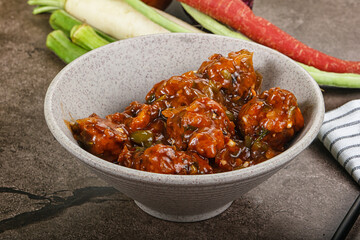Manchurian chicken with sauce and spices