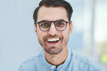 Obraz premium Eye care, excited or man with portrait for glasses in optometry office with designer frame or prescription lens. Happy customer, person or new spectacles at vision consultation for wellness or health