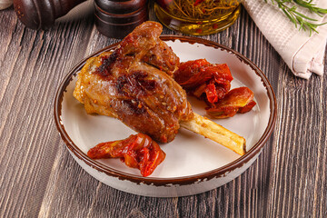 Baked lamb shank with vegetables