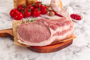 Raw potk loin steak with bone