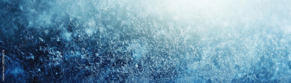 Poster A mesmerizing abstract image of swirling blue particles illuminated by soft light, perfect for backgrounds and designs.