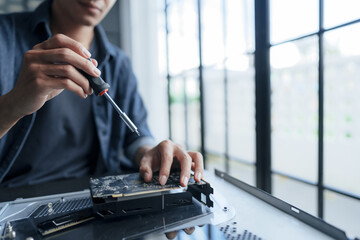 Computer repair technician specialist repairing and testing on Pc.