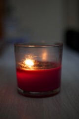 red candle in the glass
