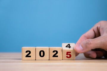 Hand flip wooden cube 2024 to 2025 for target business for the upcoming year. Planning, goal,...