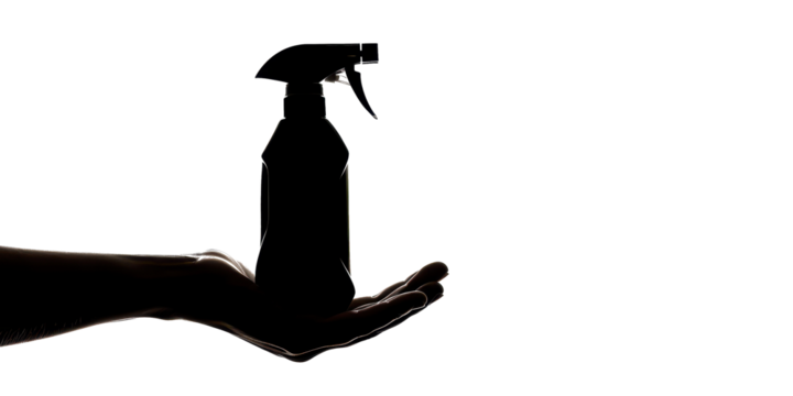 A hand holding a spray bottle - Powered by Adobe