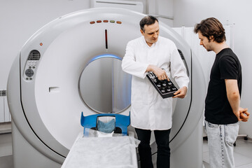 After the MRI procedure, the patient receives doctor's recommendations. MRI scanner capsule. The...