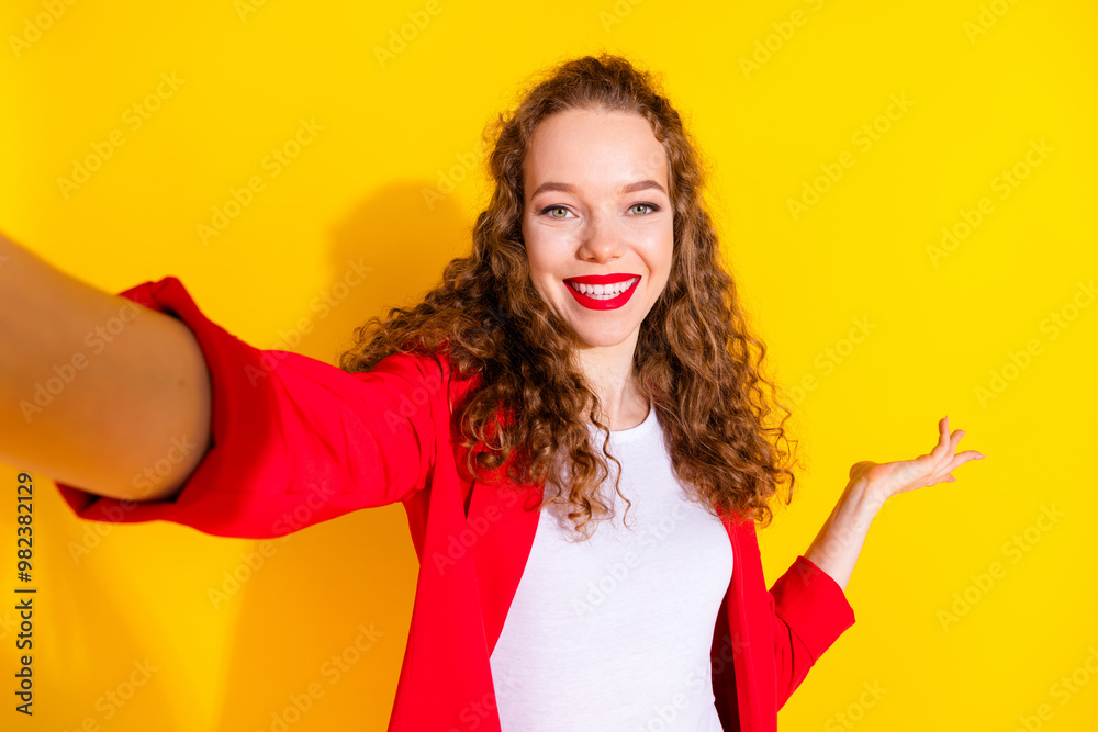 Poster Photo of pretty young woman make selfie show empty space wear red suit isolated on yellow color background