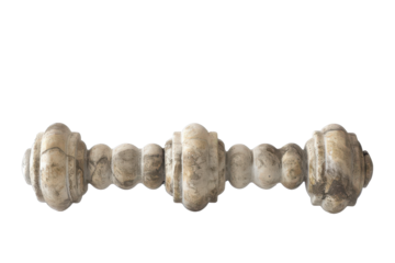 Ancient stone dumbbell resting on a plain surface showcasing unique craftsmanship in a minimalist setting.