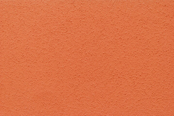 Red plastered wall background, plastered texture	
