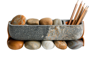 Unique pencil holder made from smooth river stones on a clean background showcasing a blend of textures and earthy colors for a minimalist workspace.
