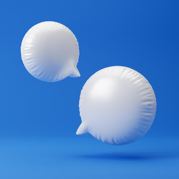 Inflated message icons isolated over blue background. 3D rendering.