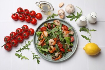 Delicious shrimp salad with ingredients on white tiled table, flat lay