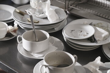 Dirty dishware on metal table