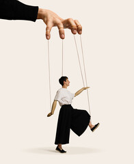 A woman with puppet hands on strings. Art collage.