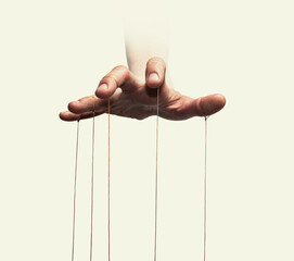 Puppeteer's hands with strings on each finger on white background.