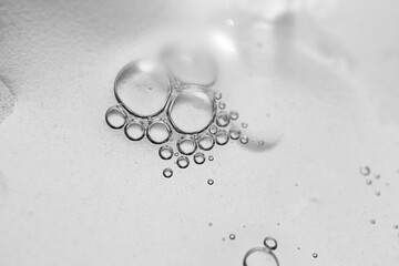 The surface of the cosmetic product has bubbles. blurred background. soft focus