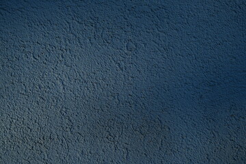 texture of putty painted blue gently orange painted wall gray plaster background, pastel blue color...