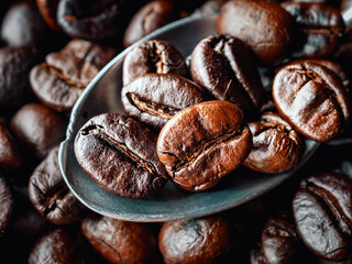 Roasted coffee bean on a stainless steel spoon, Close-up of fresh roasted coffee bean, Wallpapers of  roasted coffee bean, macro
