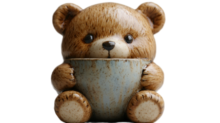 a teddy bear holding a cup
