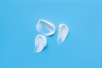 A smear of cream on a light background. Beauty concept.