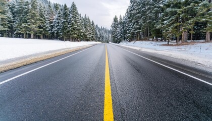 Obraz premium empty asphalt highway and winter forest nature landscape at sunrise
