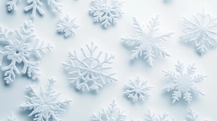 A beautiful collection of intricate snowflakes on a soft, light background, perfect for winter-themed designs and decorations.